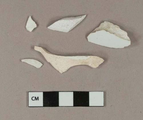 Undecorated whiteware body sherds; one sherd crossmends with undecorated whiteware base/body/handle sherd and associated glued sherds, and with one undecorated whiteware rim sherd