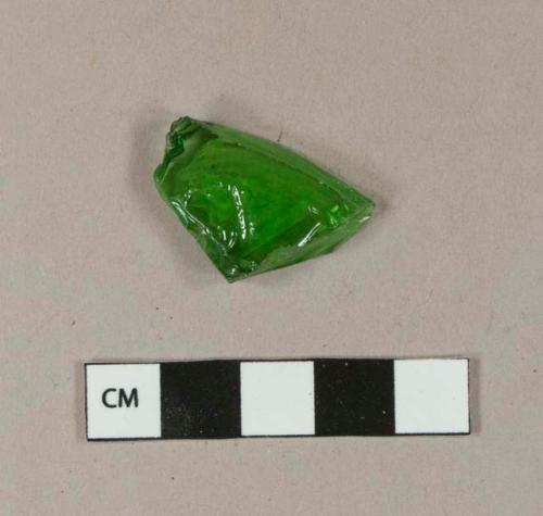 Green bottle glass fragment with molded face