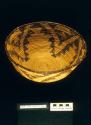 Coiled bowl-shaped basket of willow stem