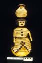 Coiled basketry figure of woman (A) with detachable olla (B) on her head