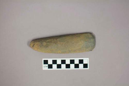 Stone adze blade; slightly hollowed