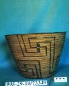 Large coiled cattail reed bowl with swastika motif
