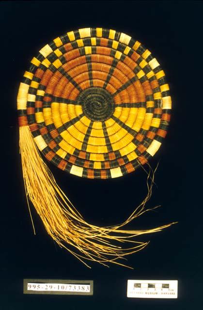 Unfinished coiled circular plaque with sunburst motif