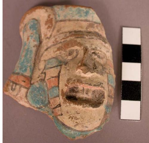 Pottery, human head