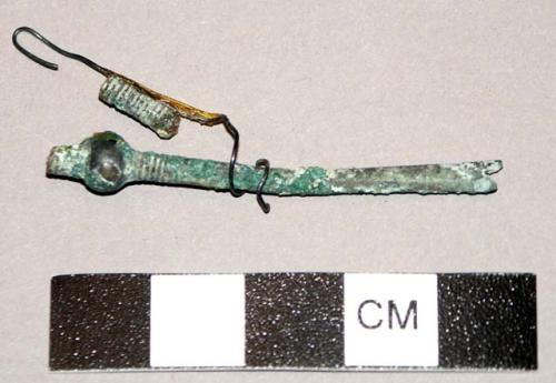 Bronze fibula fragment