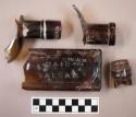 Miscellaneous pieces of brown glass. bottlenecks (3) and body piece (1). the b