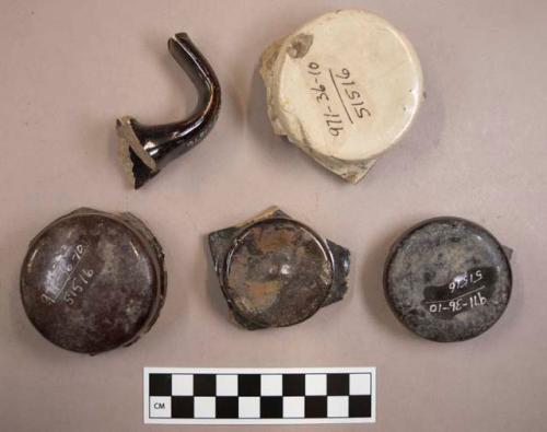 Miscellaneous handles from bean pots: 4 lid knobs, 1 body handle. brown glaze.