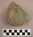 Base sherd from a flower pot, with drainage hole. exterior green paint. a four