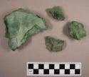 Pieces of stratified green material