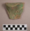 Ceramic base sherd with mold made design; Painted green
