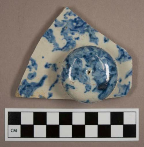 Lid sherd with knob handle. blue and white salt glaze.