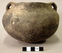 Ceramic vessel, short neck, two handles, shell tempered.