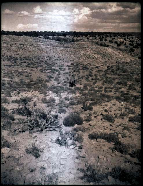 View across flat area. Two people mid-distance