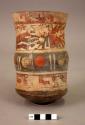 Vase painted with trophy head beings, step-frets, circles, paired lines