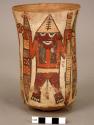 Vase painted in polychrome with three "harvester" figures