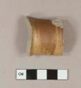 Gray-bodied, brown glazed stoneware rim sherd