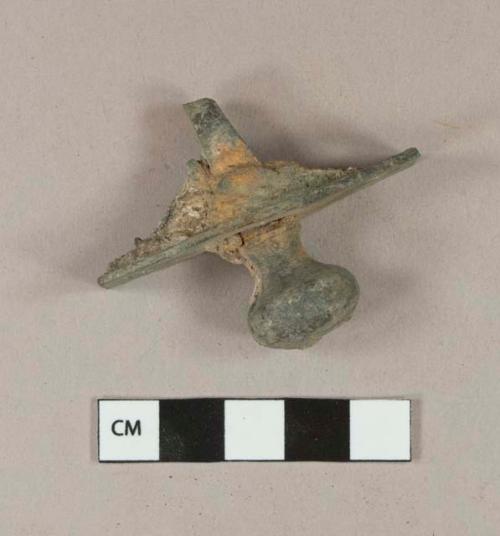 Unidentified copper alloy hardware - plate with a hole in either end and a knob through the center; possibly a door latch