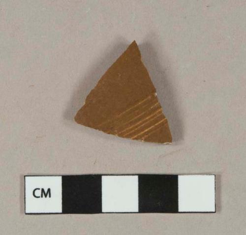 Brown salt-glazed stoneware vessel body fragment, orange paste, likely nottingham type
