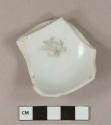 Black on white transferprinted English porcelain vessel base fragment, white paste, likely tea bowl