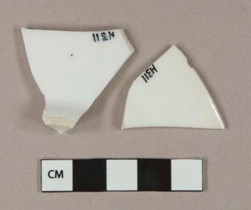 White undecorated porcelain vessel base and rim fragments, white paste