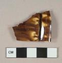 Brown mottled lead glazed earthenware vessel body fragment, buff paste, likely rockingham ware