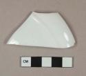 White undecorated porcelain vessel rim fragment, white paste