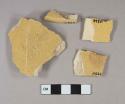 Undecorated lead glazed yellow ware vessel base, body, and rim fragments, buff paste