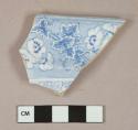 Blue on white transferprinted earthenware vessel rim fragment, white or light buff paste