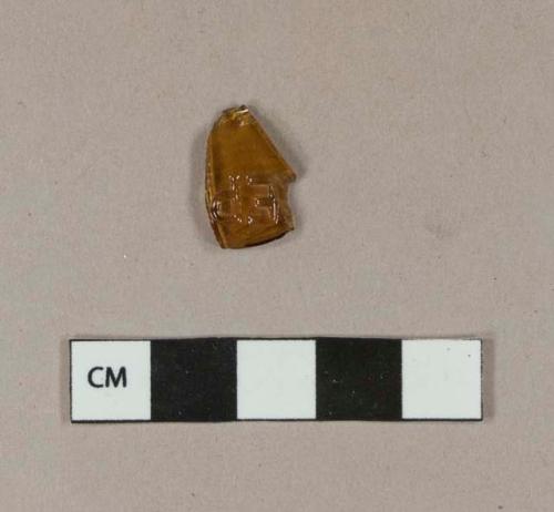 Glass, amber bottle glass fragment with embossed letters "EP"