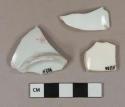 White porcelain vessel base and body fragments, 1 fragment with pink transferprint, white paste