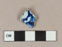 Blue on white lead glazed transferprinted earthenware vessel body fragment, white paste