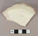 Undecorated creamware vessel base fragment, white paste