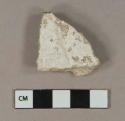 White plaster fragment
