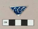 Flow blue on white pearlware vessel rim fragment, white paste