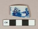 Blue on white transferprinted pearlware vessel rim fragment, white paste, figure playing the flute in pattern