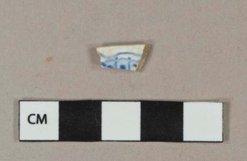 Blue on white transferprinted earthenware vessel rim fragment, light buff paste