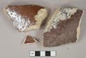 Dark reddish brown lead glazed earthenware vessel body fragments, buff paste, likely sewer pipe