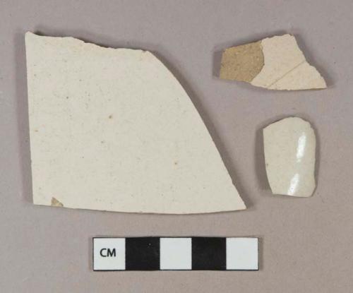 Undecorated white salt-glazed stoneware vessel body and base fragments, gray paste