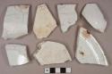 White ironstone vessel body, base, and rim fragments, white paste, 1 fragment stamped "PORCELAIN / OPAQUE / CM" in cartouche, likely Charles Meigh