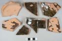 Dark brown  lead glazed redware vessel base, body, and rim fragments, 2 fragments unglazed