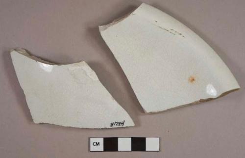 White lead-glazed ironstone vessel body and rim fragments, likely lid fragments, white paste, 1 fragment with molded decoration, stamped with "ELSMORE & FORSTER / TUNSTALL" and a heart-shaped mark