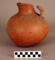 Painted earthen jar with handle