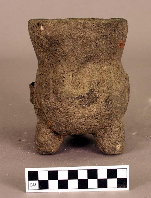 Stone vessel, 3 legs, ornamented