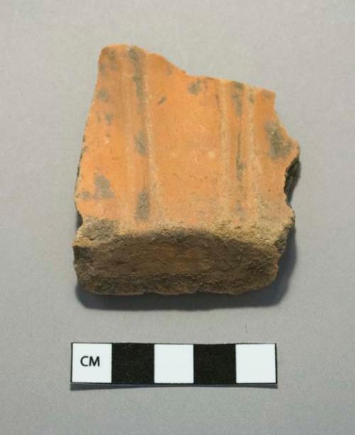 Ceramic base sherd with vertical linear design