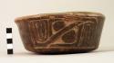 Dark brown polished potte4rybowl with carved panels on sides - unusual type