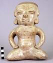 Pre-Colombian pottery female figurine (9 3/8" high), seated with legs folded, ha