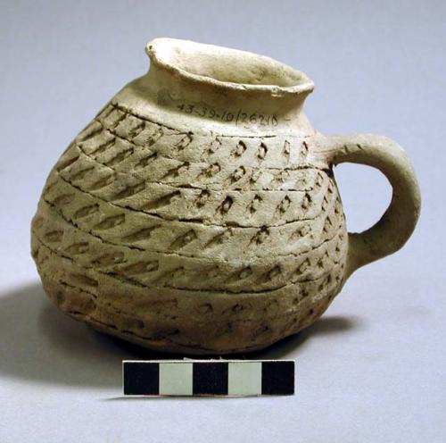 Tooled pottery handled jar