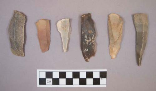 Flint blades, including cream, tan, brown, grey and blueish grey colored stone, some contain cortex