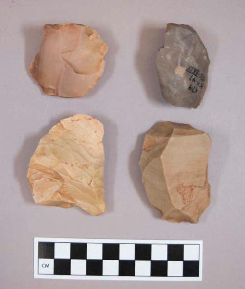 Flint flakes and cores, including tan, grey and red colored stone