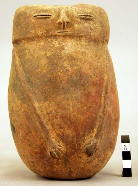 Terra cotta vase, grotesque human form